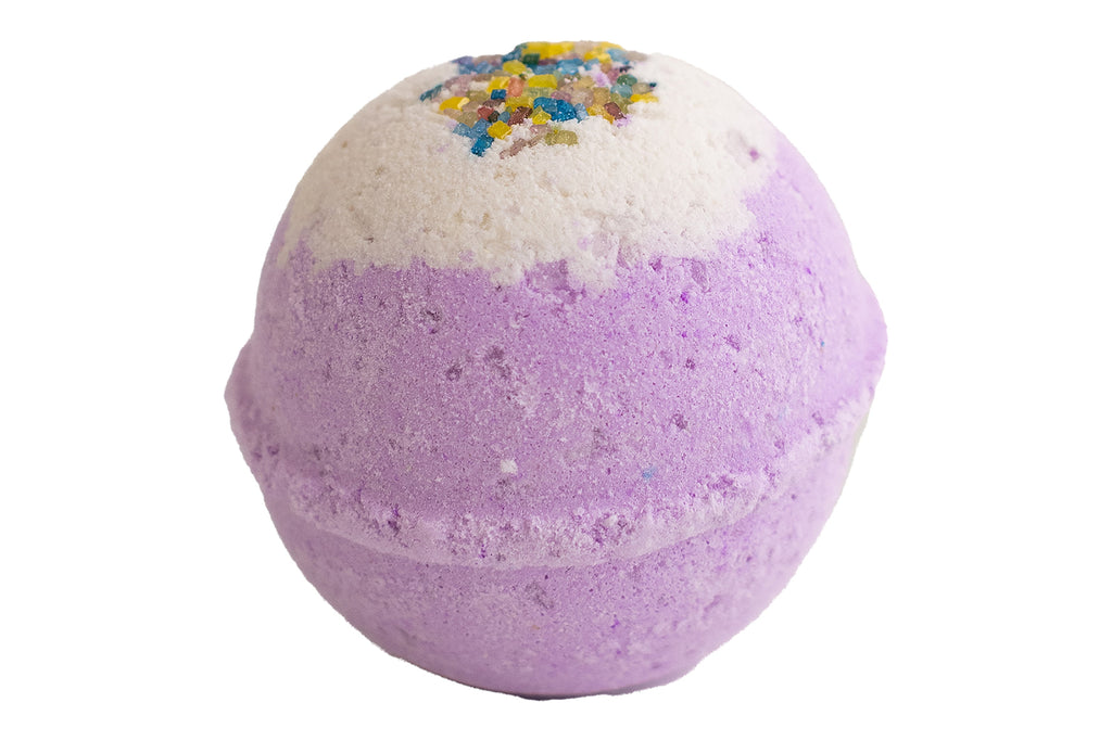 Purple bath bomb with colorful sprinkles on a white background