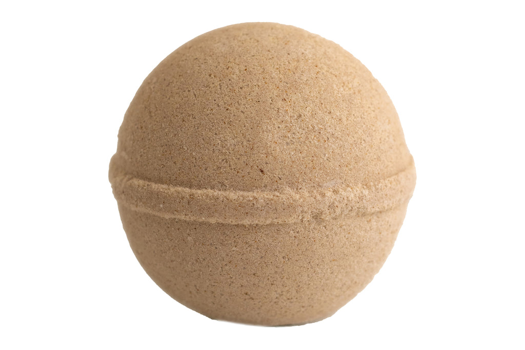 Beige bath bomb on a white background