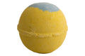 Yellow bath bomb with a gray top on a white background